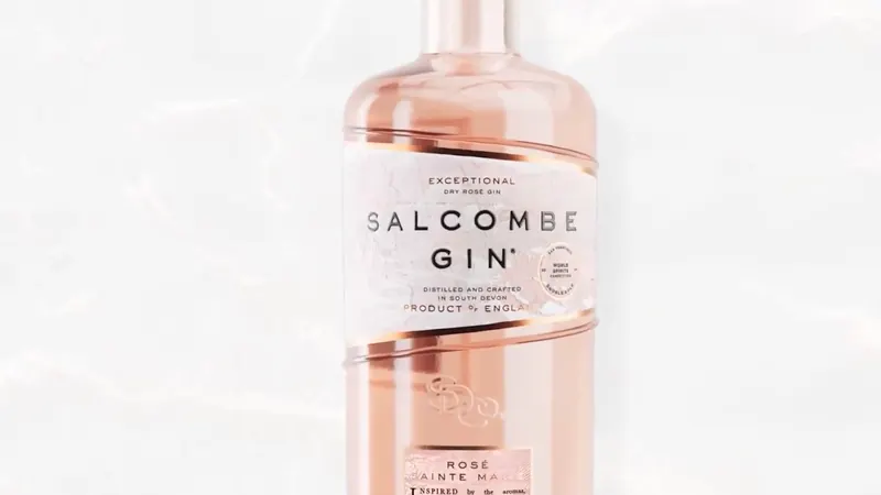 A rosé gin bottle, centered on white